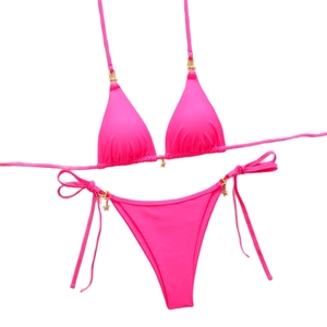 Neon pink triangle bikini set with halter neck and decorative gold star pendants