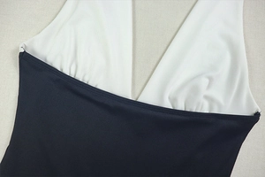 Detail of deep V-neckline on a black and white contrast high-elastic swimwear