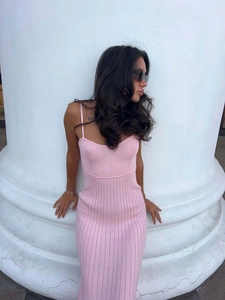 Close-up of pink vertical striped knitted dress showing thin straps and fine texture