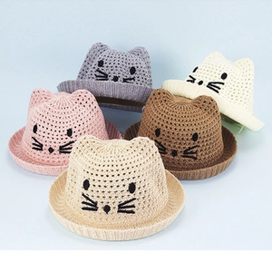 Detail of children's summer straw hats with cute cat ear designs in five assorted colors