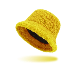 Bright yellow sherpa fleece bucket hat for winter warmth with thick faux wool texture