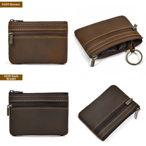 Detail view of vintage crazy horse leather coin purse with double zippers and key ring