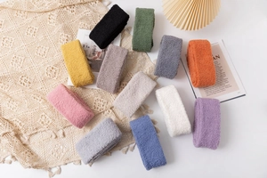 Flat lay of soft coral fleece over-knee socks in eleven vibrant colors for winter warmth