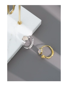 Detail of S925 sterling silver branch ring with inlaid agate stone and bud textures