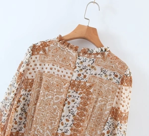 Close-up of bohemian floral dress back with paisley print and invisible zipper detail