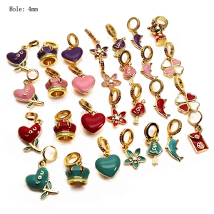 Golden enamel charms set with heart, clover, and crown shapes featuring 4mm hole size
