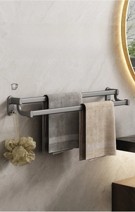 Detail view of double towel rack in gun grey finish with hooks on marble wall