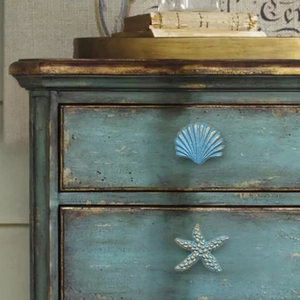 Mediterranean blue shell and starfish furniture handles on a vintage wooden dresser