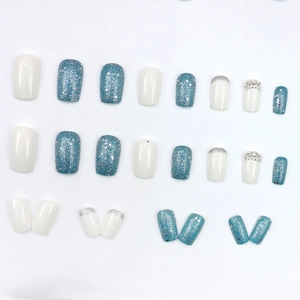 Blue glitter and milk white press-on nails set with rhinestones and pearls decoration