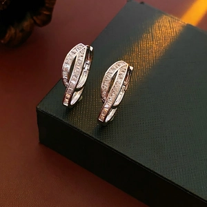 Elegant silver double-layer crisscross hoop earrings with pavé cubic zirconia accents