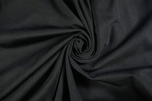 Detailed macro view of black ruched knit fabric texture and premium stretch material
