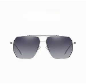 Detail of silver metal frame and grey gradient lenses on pilot style sunglasses