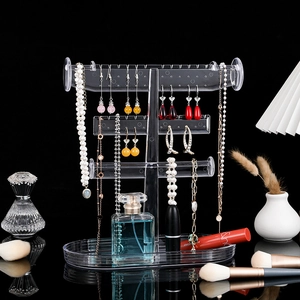 Three-tier transparent acrylic jewelry display stand with a bottom tray for earrings and necklaces