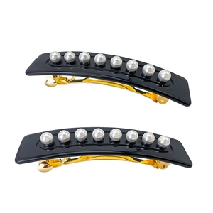 Set of two black acetate hair clips with elegant white pearls and gold metal base