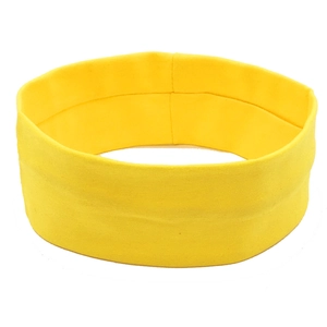 Close-up of bright yellow yoga headband showing elastic knitted fabric texture
