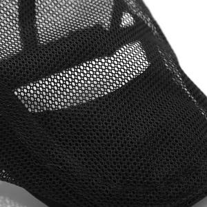 Close-up of black breathable honeycomb mesh fabric showing fine texture and airy structure
