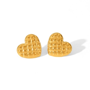 Detailed macro view of 18K gold plated heart earrings featuring a quilted diamond pattern