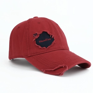 Distressed vintage cotton baseball cap with maple embroidery and frayed edge details