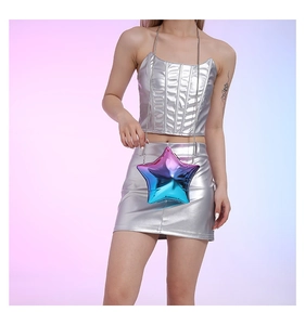 Detail of star-shaped crossbody bag with holographic gradient metallic finish and chain