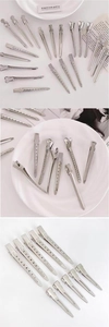 Close-up of professional silver metal hair clips for salon styling and sectioning