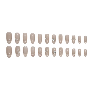 Oval nude and white French press-on nails with elegant pearls and rhinestone accents
