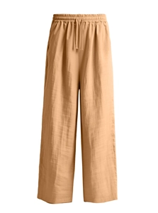 Detailed view of khaki cotton linen trousers with elastic drawstring waist and texture