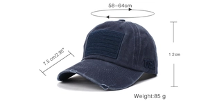 Detail view of navy blue baseball cap featuring vintage USA embroidery and distressed edges
