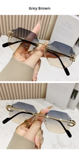 Detail view of grey brown gradient lenses with rimless polygonal cut and gold metal arms