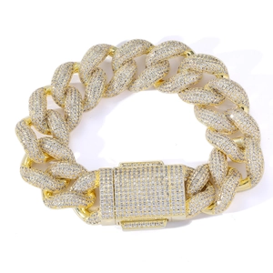 Detail of 18mm golden Cuban link chain with full zircon paving and box safety clasp