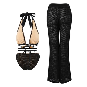 Detailed view of the beaded strappy bikini top with matching mesh crochet beach trousers