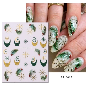 Close-up of 5D embossed Christmas nail stickers with gold stars and pine branch patterns