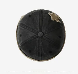 Top view of two-tone vintage skull cap featuring a distressed star patch detail