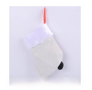 Back view of a white knitted Christmas stocking with white plush trim and red hanging loop