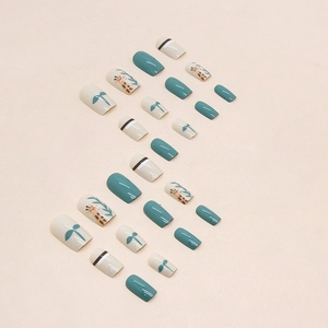 Cute giraffe and leaf pattern press-on nails in lake green and beige morandi tones