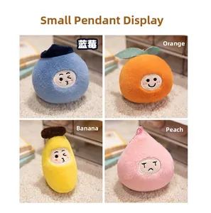 Detailed view of four colorful fruit plush keychains including orange and banana charms