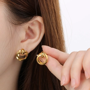 Exquisite gold stainless steel double hoop geometric earrings shown on model