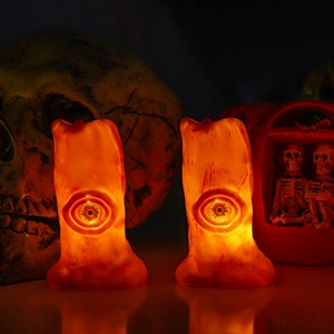 Halloween LED candle lights with bloodshot eyeball design emitting warm glowing light