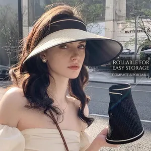 Detail view of foldable sun visor with straw brim and portable roll-up storage design