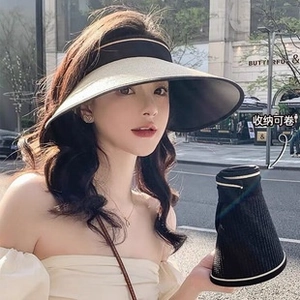 Detail view of foldable sun visor with straw brim and portable roll-up storage design