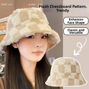 Detail of plush checkerboard bucket hat featuring a soft faux fur finish and mini label