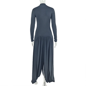 Detail of elegant dark grey long sleeve jumpsuit with back slit collar and pleated hem