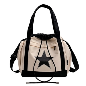 Versatile canvas tote bag with star logo and adjustable strap for couple travel