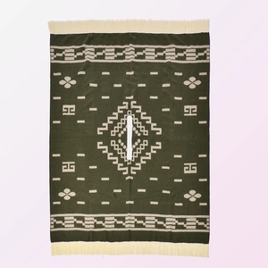 Western style green poncho with beige floral geometric patterns and fringe edges