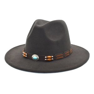 Detail of wool fedora hat featuring a leather band with turquoise stone and wood beads