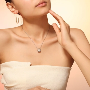 Elegant gold-plated titanium necklace with pearl pendant and matching U-shaped earrings