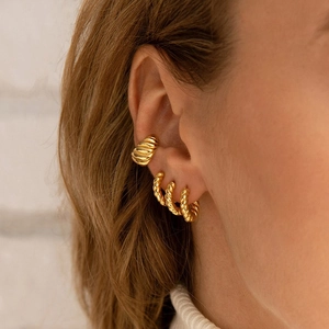 Golden twisted rope hoop earrings and croissant ear cuff set for women on ear model