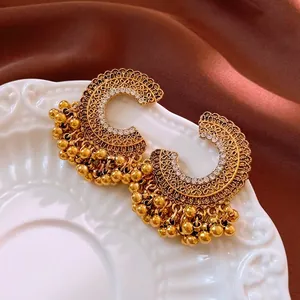 Vintage gold-plated floral hollow earrings with white rhinestones and beaded tassels