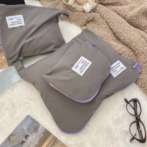 Three-piece dark grey waterproof travel organizer set with vibrant purple zipper details