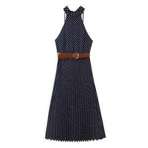 Detail of dark blue polka dot halter midi dress with accordion pleats and brown belt