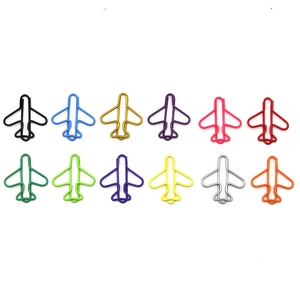 Detailed view of 12 colorful airplane shaped metal paperclips organized in rows